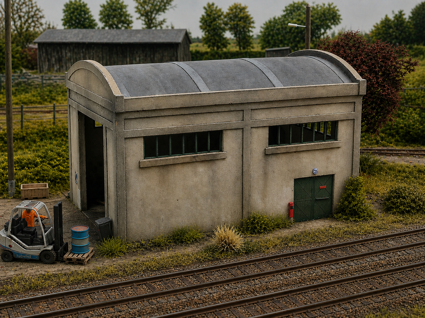 Remise à locotracteur HO 1/87 maquette Bastrains en décor ferroviaire industriel réaliste